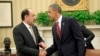 President Barack Obama shakes hands with Iraqi Prime Minister Nouri al-Maliki, Nov. 1, 2013, following their meeting in the Oval Office of the White House.