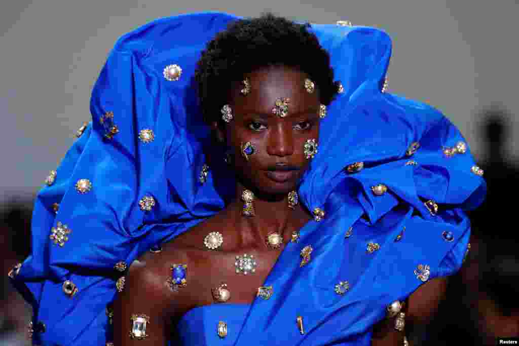 A model presents a creation by designer Daniel Roseberry as part of his Haute Couture Spring/Summer 2020 collection show for fashion house Schiaparelli in Paris, France.