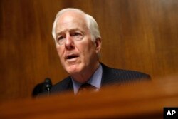 FILE - Senate Majority Whip Sen. John Cornyn, R-Texas, speaks during a hearing on Capitol Hill, May 8, 2019.