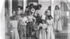 Patients at Tuberculosis Sanitorium with glasses of milk, Phoenix Indian School, c. 1890-1910. 