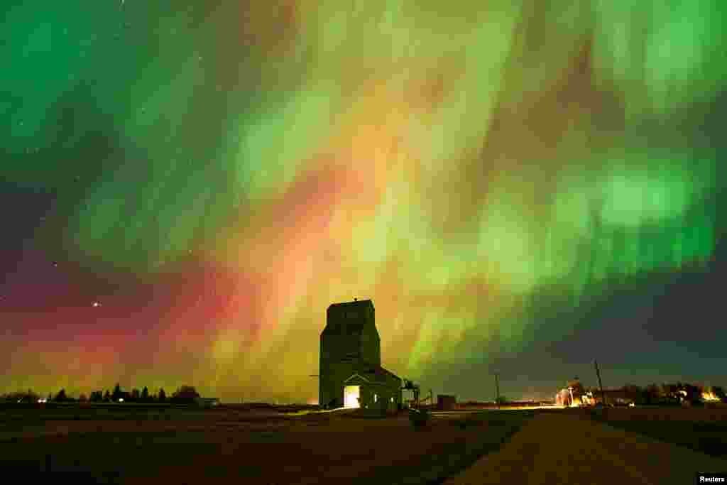 The aurora borealis, also known as the northern lights, light up the sky over an old grain elevator in Brant, Alberta, Canada, Oct. 7, 2024.