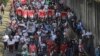ARCHIVO: Los manifestantes portan pancartas del Frente Sandinista de Liberación Nacional y un retrato del presidente Daniel Ortega y la vicepresidenta Rosario Murillo, durante una marcha a favor del gobierno en Managua, Nicaragua, el sábado 11 de febrero de 2023. (Foto AP)