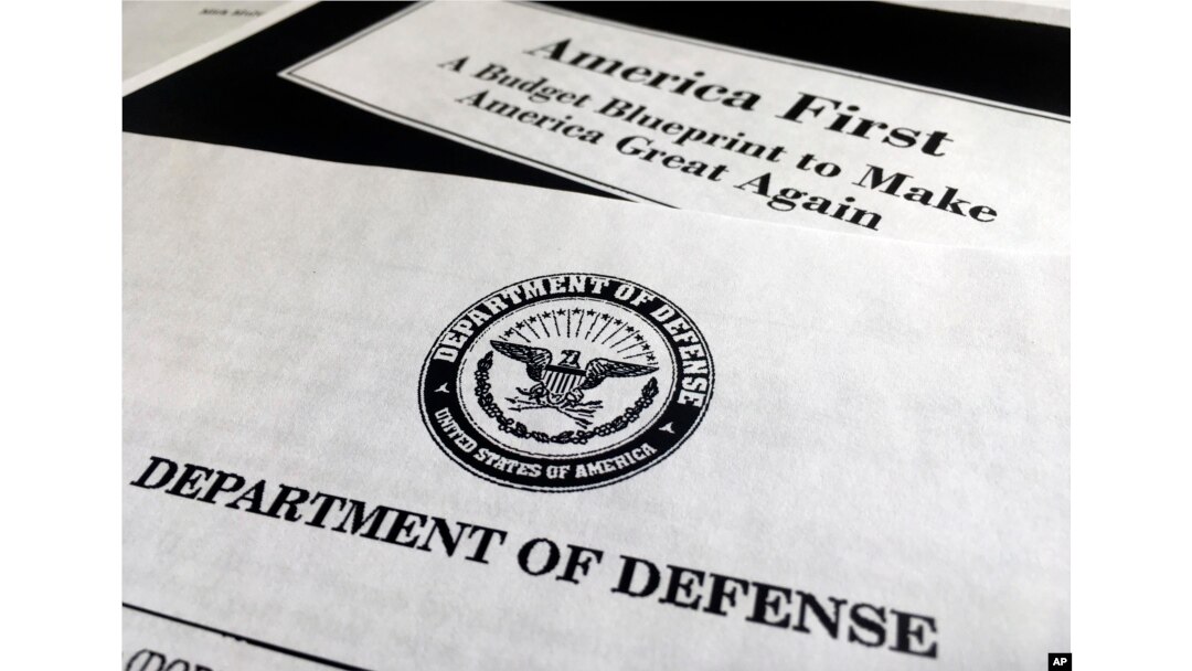 FILE - A portion of President Donald Trump's first proposed budget, focusing on the Department of Defense, and released by the Office of Management and Budget, is photographed in Washington, March 15, 2017.