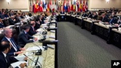 FILE - Representatives of the Global Coalition to Counter IS meet at Joint Base Andrews, Maryland, outside Washington, D.C., July 20, 2016.