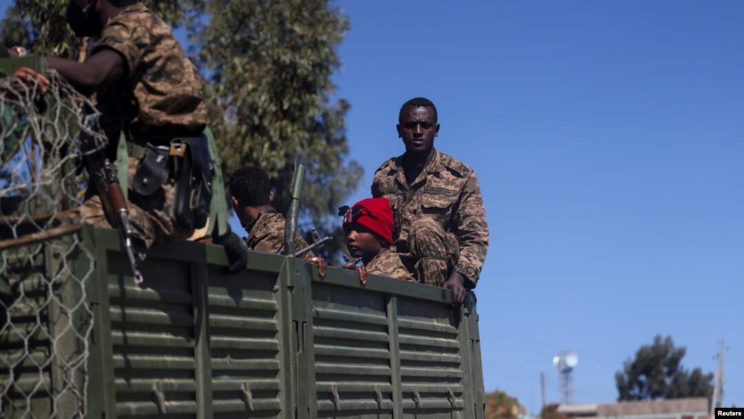 FILE - Ethiopian soldiers ride on a truck near the town of Adigrat, Tigray region, Ethiopia, March 18, 2021. 
