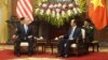 U.S. Defense Secretary Jim Mattis chats with Vietnamese President Tran Dai Quang at the presidential palace in Hanoi, Vietnam, Jan. 25, 2018.