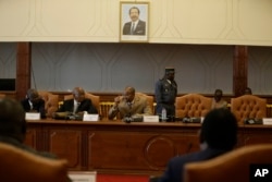 Essombe Emile, President of Cameroon Constitutional Council, center, speaks during a meeting with representatives of the political parties and members of the Electoral commissions in Yaounde, Oct. 10, 2018.