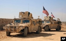 U.S. forces take up positions on the outskirts of the Syrian town, Manbij, a flashpoint between Turkish troops and allied Syrian fighters and U.S.-backed Kurdish fighters, March 7, 2017.