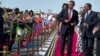 President Barack Obama, followed by first lady Michelle Obama, does a dance upon his arrival ceremony with Tanzanian President Jakaya Kikwete, right, July 1, 2013, at Julius Nyerere International Airport in Dar Es Salaam, Tanzania.