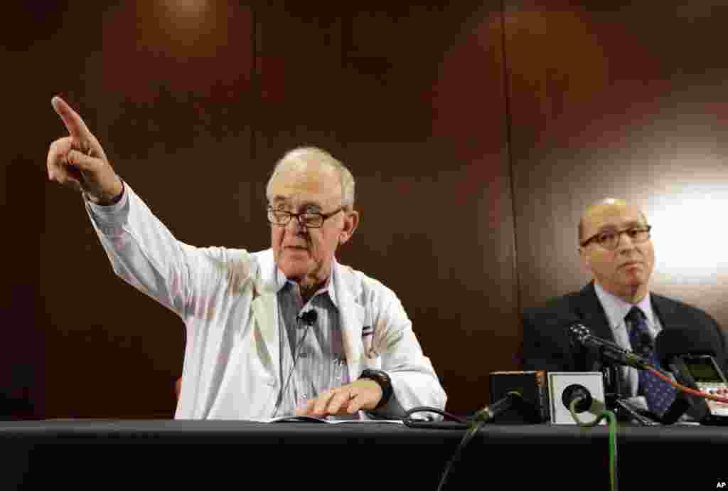 Dr. Edward Goodman (left) epidemiologist at Texas Health Presbyterian Hospital Dallas, takes a question from a reporter as Dr. Mark Lester looks on during a news conference about their patient infected with the Ebola virus. The patient is the first person in the U.S. diagnosed with Ebola, in Dallas, Texas, Sept. 30, 2014.