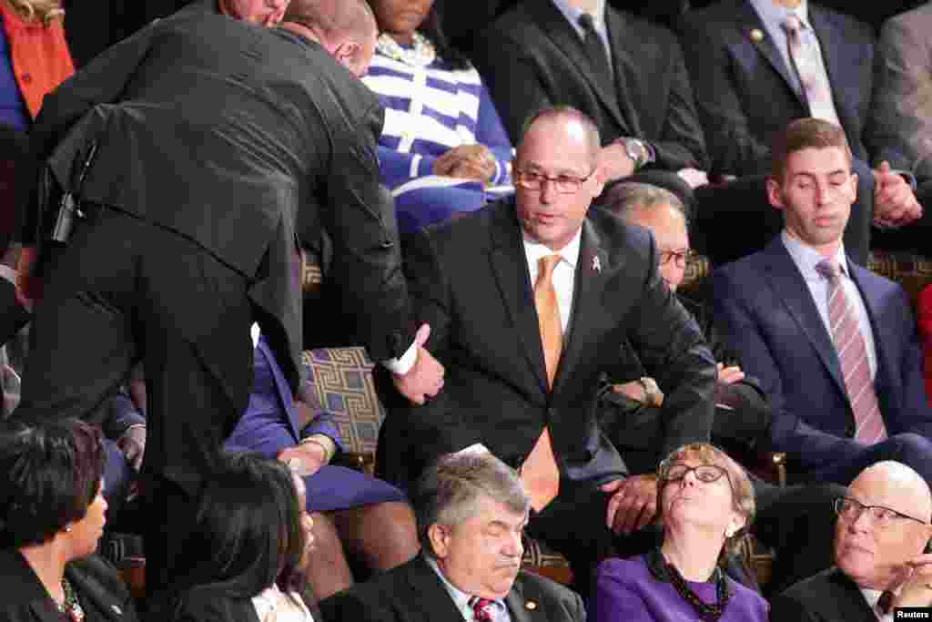 Fred Guttenberg, father of Parkland school shooting victim Jaime Guttenberg, is ejected after shouting during U.S. President Donald Trump's State of the Union address to a joint session of the Congress in the House Chamber of the U.S. Capitol in Washington, Feb. 4, 2020.