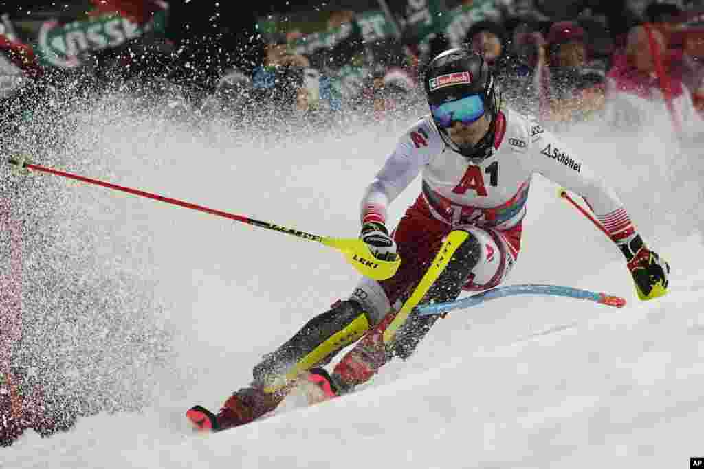 Austria's Manuel Feller speeds down the course during an Alpine ski, men's World Cup slalom, in Schladming, Austria.