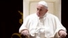 FILE - Pope Francis attends the traditional greetings to the Roman Curia, at the Vatican, Dec. 21, 2018.