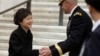 South Korean President Park Geun-hye (L) prepares to leave after presenting a wreath at the Tomb of the Unknown Soldier at Arlington National Cemetery near Washington, May 6, 2013. 
