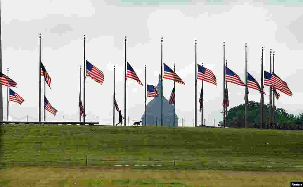 U.S. flags fly at half-staff on the National Mall to commemorate the victims of the coronavirus disease (COVID-19) in Washington, D.C., May 23, 2020.