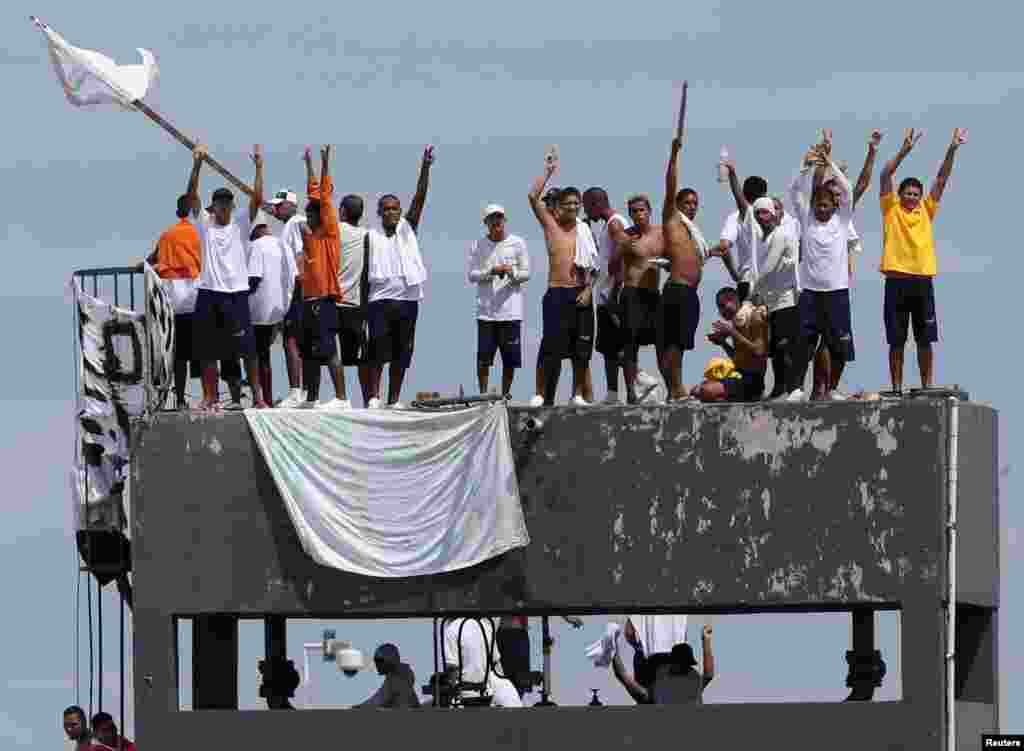 Inmates at Puraquequara's prison are seen on the roof during a riot following an outbreak of the coronavirus disease (COVID-19), in Manuas, Brazil, May 2, 2020.
