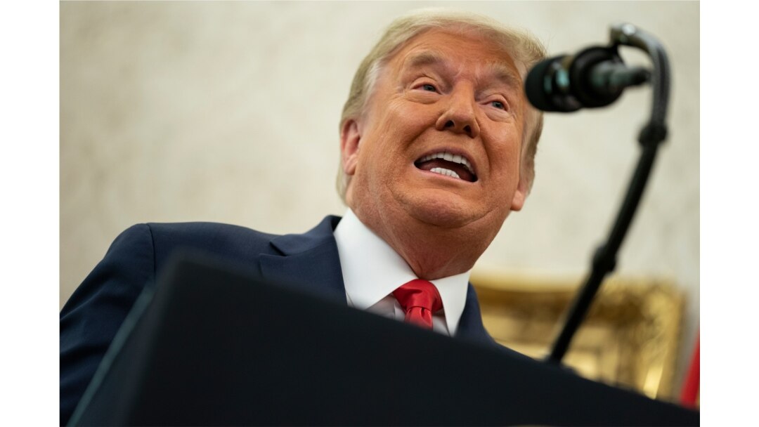 Donald Trump speaks during a ceremony in the Oval Office of the White House, Dec. 3, 2020, in Washington.