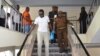 Tanzanian investigative journalist Erick Kabendera leaves after he appeared at the Kisutu residents magistrate court in Dar es Salaam, Tanzania, Sept. 12, 2019.