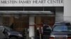 Members of the Secret Service stand outside the Vivian And Seymour Milstein Family Health Center at the NewYork-Presbyterian Hospital where U.S. Secretary of State Hillary Clinton remains hospitalized in New York, January 1, 2013. 