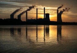 FILE - The coal-fired Plant Scherer in Juliette, Ga., June 3, 2017. The Trump administration is doing away with a decades-old air emissions policy opposed by fossil fuel companies, a move that environmental groups say will result in more pollution.