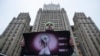 Andrei Nikolayev, an activist of the Green Alternative party, protests outside the Foreign Ministry headquarters building, to call on officials to do more to prevent the spread of the coronavirus, in Moscow, Jan. 24, 2020.