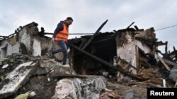 Развалины жилого дома, разрушенного в результате российского ракетного удара. Запорожье, 9 апреля 2023 г.