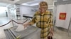 A woman casts her ballot in Sevastopol, Crimea, Ukraine on September 23, 2022. REUTERS/Alexey Pavlishak