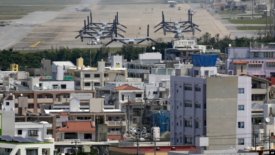 FILE - MV-22 Ospreys are seen at the U.S. Marine Corps Futenma Air Station and the surrounding area from an observation deck at a park in Ginowan, Okinawa Prefecture, Japan.