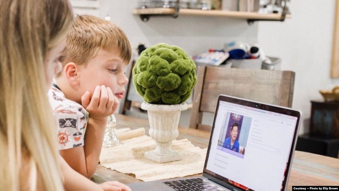Mom uses telemedicine to talk with Dr. William Chu, medical director of the NightLight Pediatric Urgent Care clinics, Houston, Texas. (Photo courtesy Elly Brown)