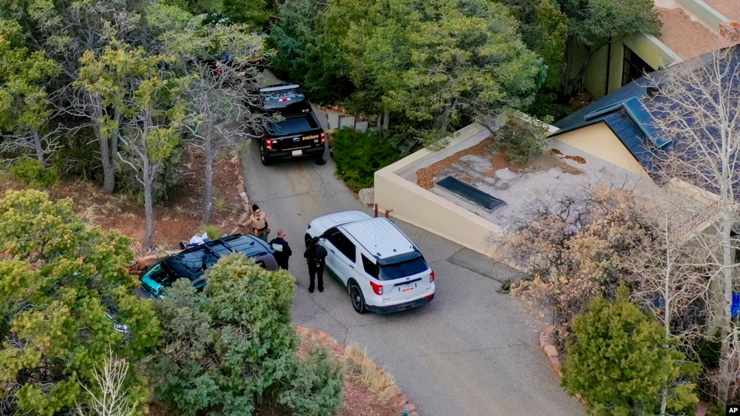 Santa Fe County deputies remain outside the house belonging to actor Gene Hackman and his wife, Betsy Arakawa, who were earlier found dead, in Santa Fe, New Mexico, Feb. 27, 2025.
