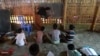 Rohingya refugee children study in a school at Kutupalong refugee camp, in Ukhia on Oct. 5, 2020.