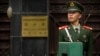 A Chinese paramilitary policeman stands guard outside of the North Korean Embassy in Beijing, April 20, 2017. 