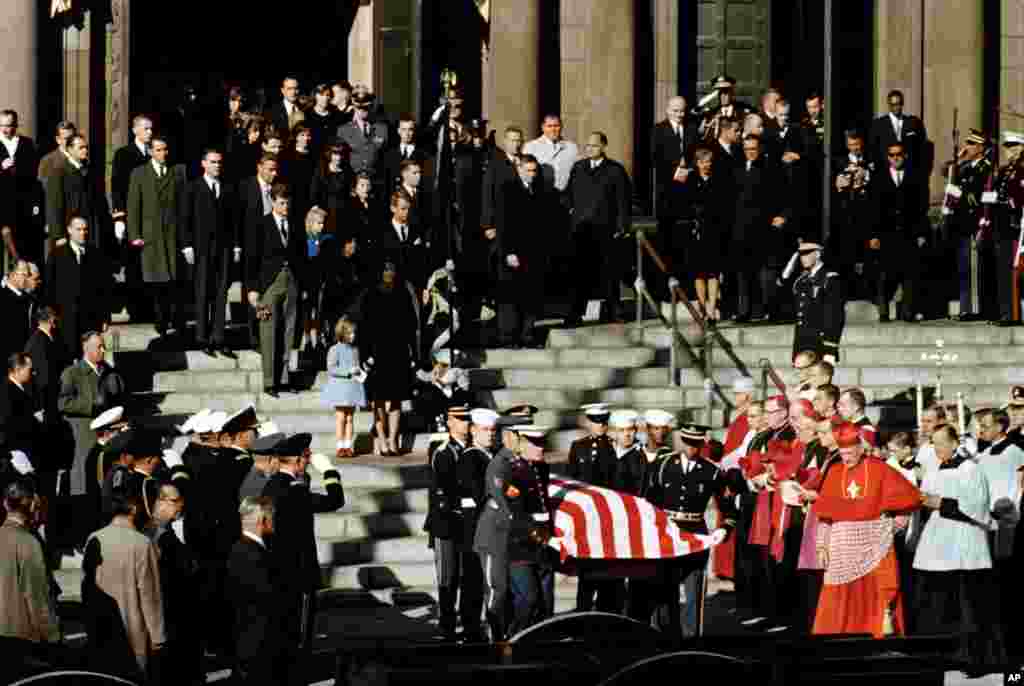 Representatives of all branches of the military act as pall bearers during the funeral of President John F. Kennedy as they leave following funeral services at St. Matthew's Cathedral in Washington, Nov. 25, 1963.