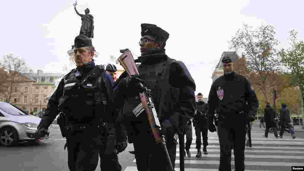 Police patrol in Place de la Republique Saturday after a series of deadly attacks the previous day in Paris, Nov. 15, 2015.