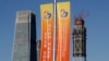 Banners promoting the Belt and Road Forum for International Cooperation are placed between skyscrapers in the central business district in Beijing, May 11, 2017.