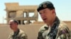 General Rupert Jones, Deputy Commanding General of the Coalition Joint Task Force, right, speaks during a press conference at the Civil Council of Raqqa, in Ain Issa, northeast Syria, July 23, 2017. 