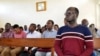Tanzanian investigative journalist Erick Kabendera sits inside the Kisutu Residents Magistrate Court in Dar es Salaam, Tanzania, Aug. 5, 2019. 