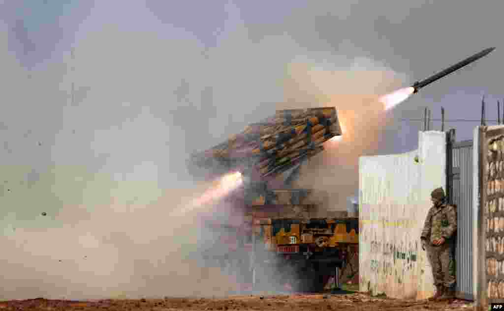 A Turkish military mobile rocket launcher fires from a position in the countryside of the Syrian province of Idlib toward Syrian government forces' positions in the countryside of neighboring Aleppo province.