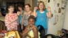 Madison Blandford (far left) and her classmates and neighbors show off their Ugandan beads at Madison's recent jewelry party. (VOA/F. Elmasry)