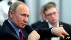 Russian President Vladimir Putin speaks during a meeting with students and researchers of an industrial college in Cherepovets, Russia, Feb. 4, 2020.