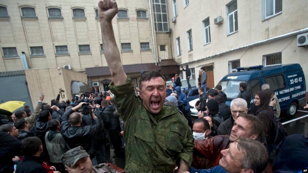 A man cheers after being released from a local police station after it was stormed by pro-Russian protesters in Odessa, Ukraine, on May 4, 2014. 
