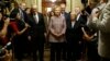 Democratic U.S. presidential candidate Hillary Clinton walks with Senate Minority Leader Harry Reid (D-Nev.) (L), Senator Chuck Schumer (D-N.Y.) (3rd R), Senator Patty Murray (D-Wash.) (2nd R) and Senator Dick Durbin (D-Ill.) (R) as she arrives to meet with Senate Democrats during their luncheon gathering at the U.S. Capitol in Washington, July 14, 2016.