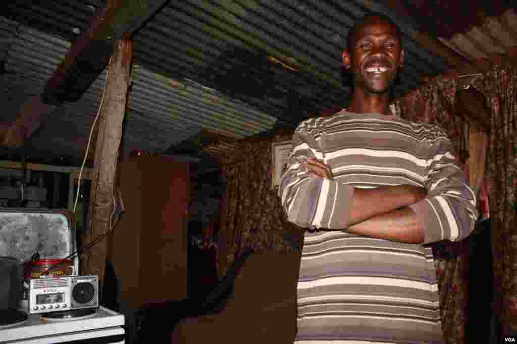 Job Mohalalelwa stands in his small shack in Munsieville west of Johannesburg. He says he was “resurrected from the dead.” (Photo by Darren Taylor)