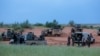 FILE - Malian soldiers are seen during a patrol in Dansongo Circle, Mali, Aug. 23, 2021. The Mauritanian government has accused Mali of “criminal acts” against Mauritanians on Malian territory.