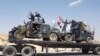 Thousands Flee as Iraq Steps Up Airstrikes on IS-held Town