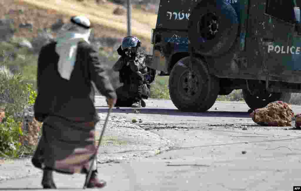 Israeli security forces keep position during clashes with Palestinian protesters in the village of Baita south of Nablus in the occupied West Bank.