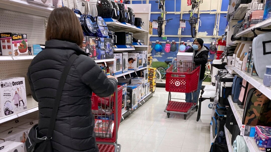 Shoppers shop at a retail store in Niles, Ill., Dec. 18, 2021. 
