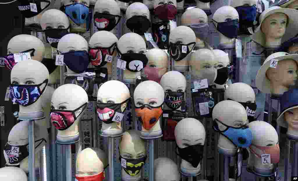 Masks placed on mannequins heads are displayed outside a shop in Sarajevo's main street, Bosnia.