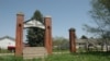 Exterior gate of the former Indian Industrial School in Genoa, Nebraska, which opened in 1884 and continued operating until 1933.