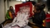 FILE - Election worker Kristen Mun empties ballots from a ballot box in Portland, Oregon, on Nov. 3, 2020. Newly declassified intelligence says the Kremlin believes it has had success in disrupting the past two U.S. presidential elections.